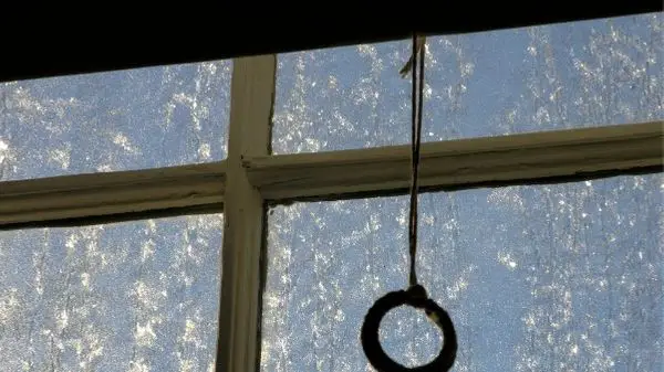 window with shade handle hanging